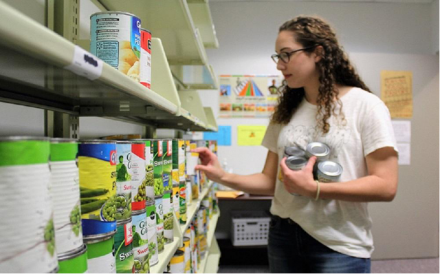 Student inside Food for Thought Pantry
