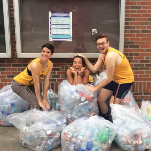 Sustainable Campus Past Program Coordinator with Students and Recyclables