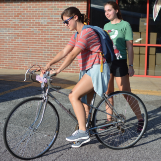 Two People with Bikes