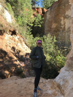 Ana for sustainability journeys; a young woman stands in Providence Canyon
