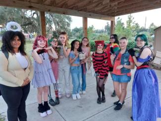 a group photo of costume contest participants